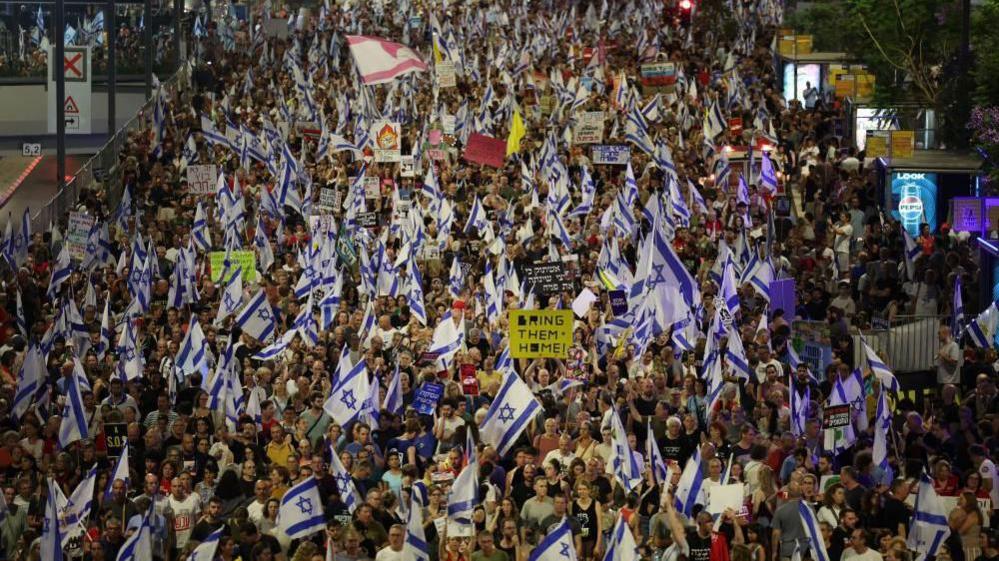 People calling on the Israeli war cabinet to sign a hostage deal take part in a protest rally outside the Kirya military headquarters in Tel Aviv, Israel, 15 June 2024. 