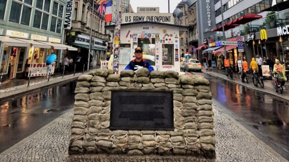 Karim Goodchild at the site of Checkpoint Charlie in Berlin