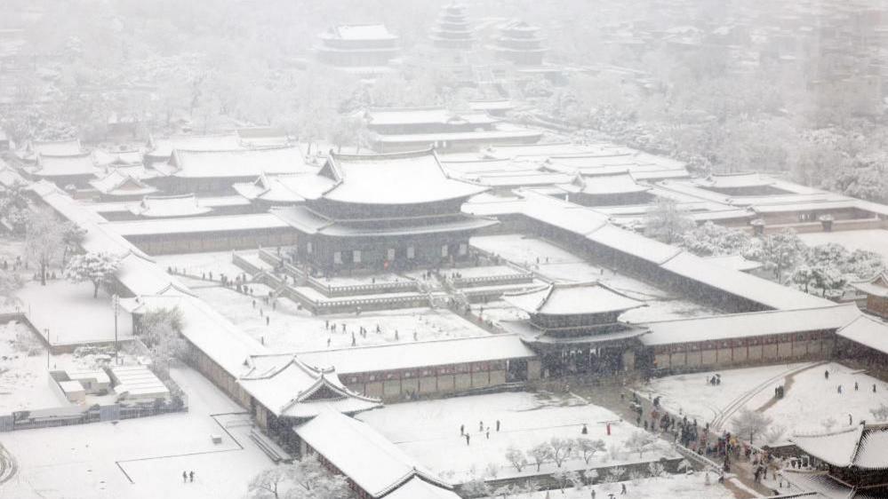 Gyeongbokgung Palace is blanketed with snow amid a heavy snow alert in downtown Seoul, South Korea.