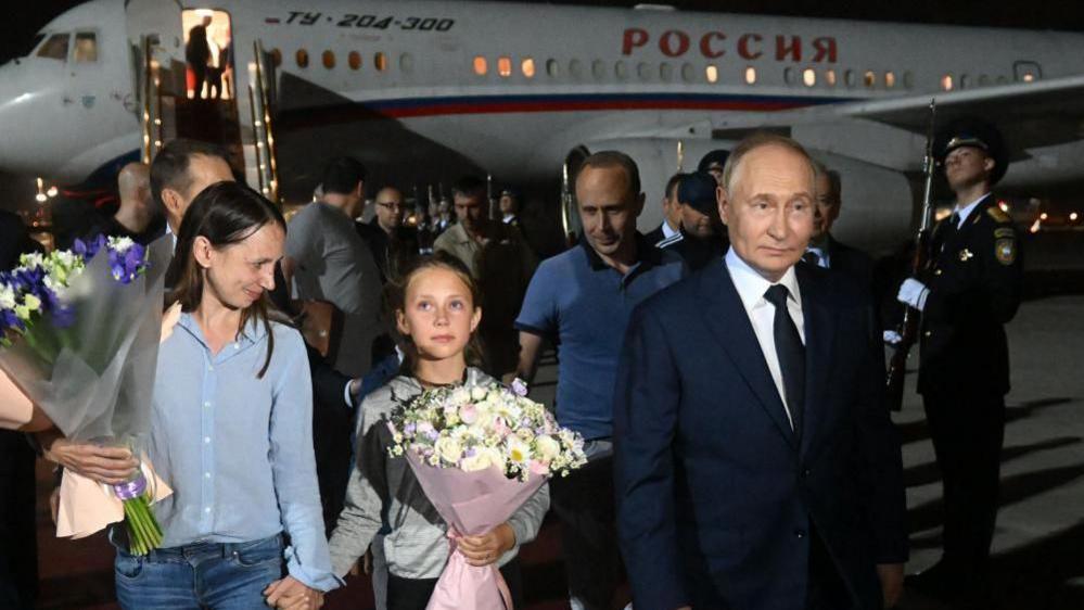 Russian President Vladimir Putin (R) meets Russian citizens released after the Russian-US prisoner swap in Turkiye at Vnukovo International Airport in Moscow, Russia, 01 August 2024. 