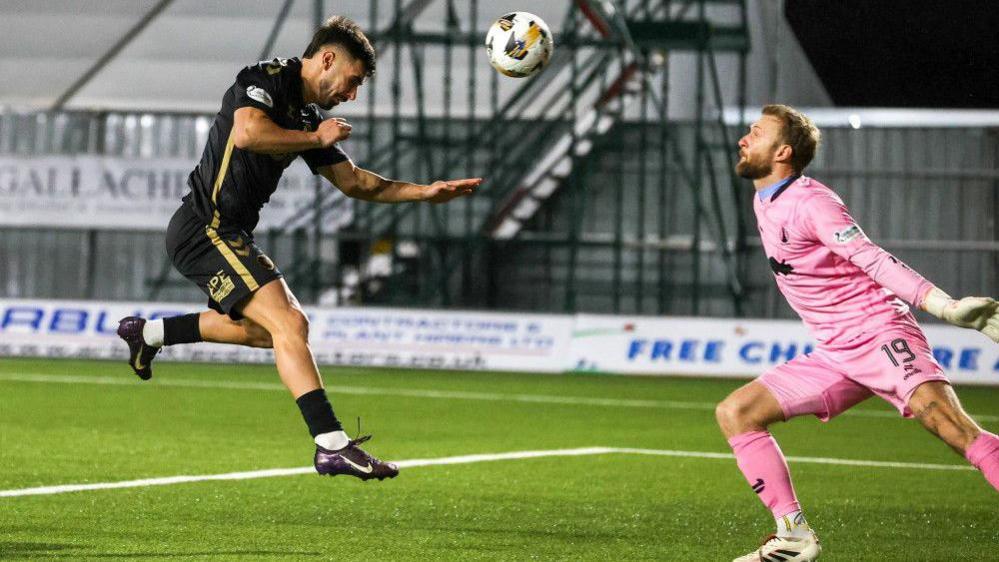 Hearts Claudio Braga scores to make it 1-0 during a William Hill Premiership match between Falkirk and Heart of Midlothian at the Falkirk Stadium