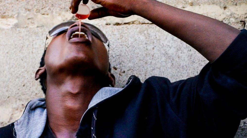 Boy pours codeine cough syrup down his throat