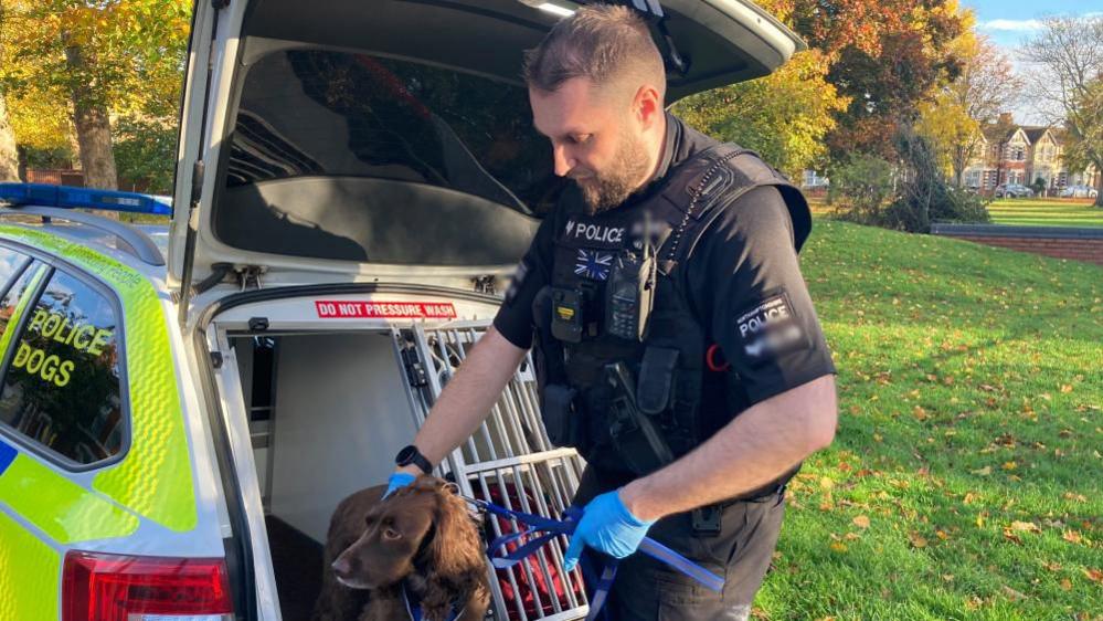 Sgt Chris Monday and PD Bonnie getting out the police car