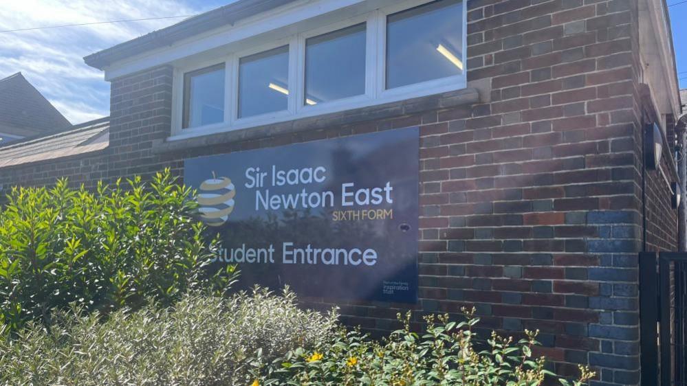 Sir Isaac Newton Sixth Form College sign and entrance