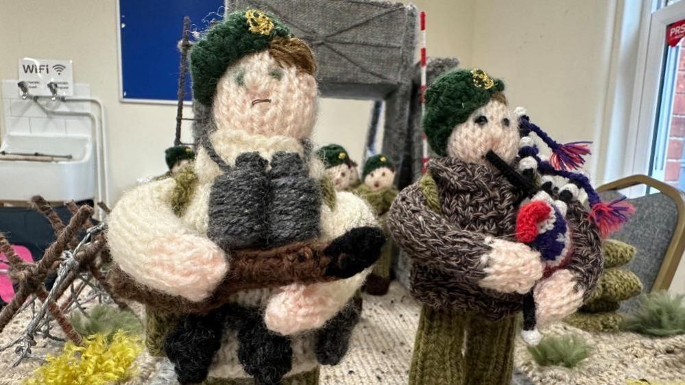 Two knitted soliders 