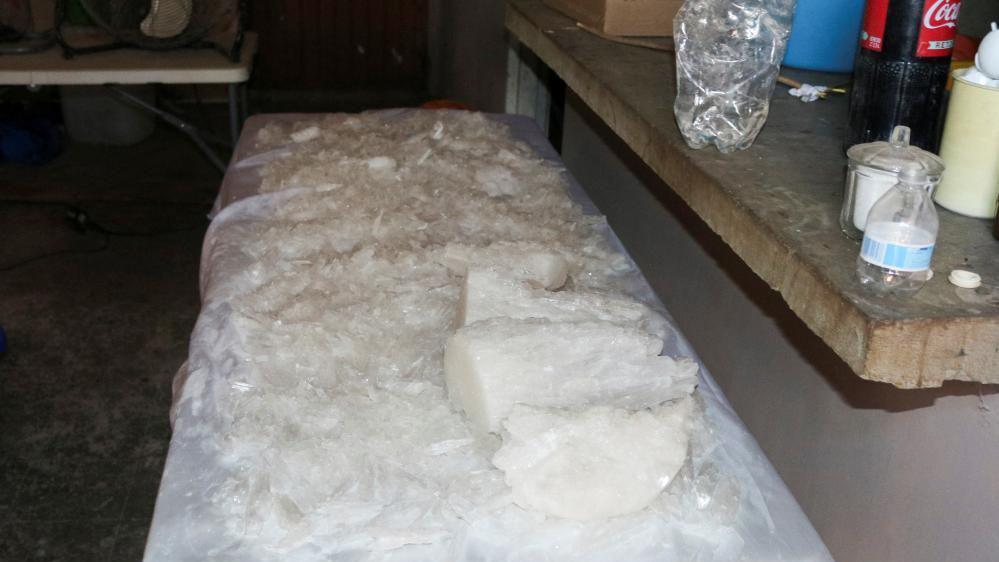 Meth crystals are lying on a table inside one of the warehouses raided by soldiers on the weekend in Sinaloa state.