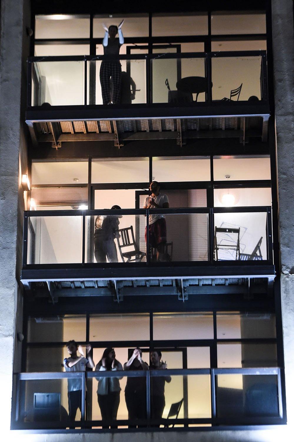 People applauding from balconies