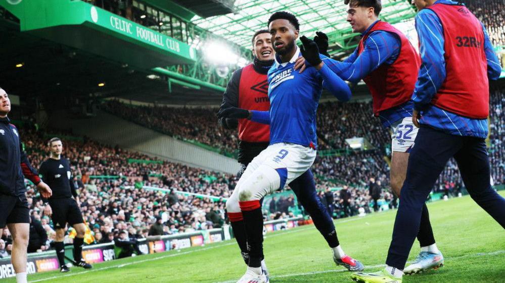 Youssef Chermiti celebrates at Celtic Park
