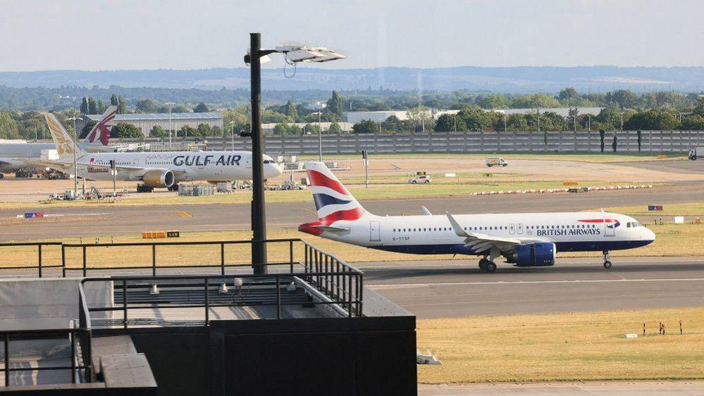 A plane prepares ahead of taking-off, after radar failure led to the suspension of outbound flights across the UK, at Heathrow Airport in Hounslow, London, Britain, July 30, 2025.