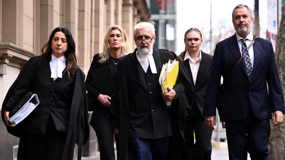 Patterson's legal team, lead by Richard Edney (centre)