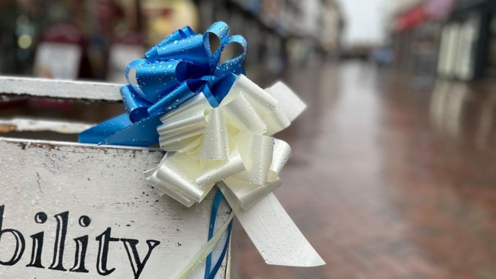 Blue and white ribbons in a street