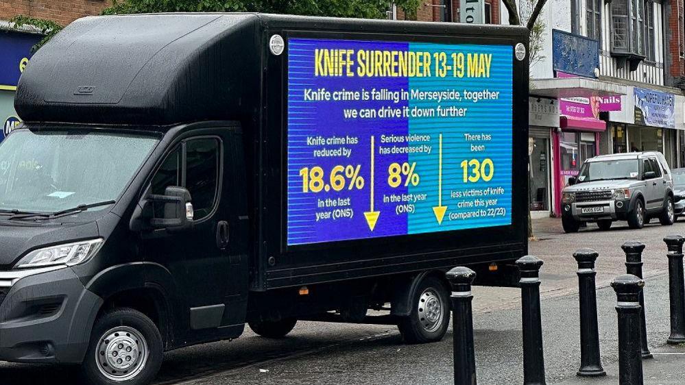 Van with a digital display showing information about the Knife Surrender week