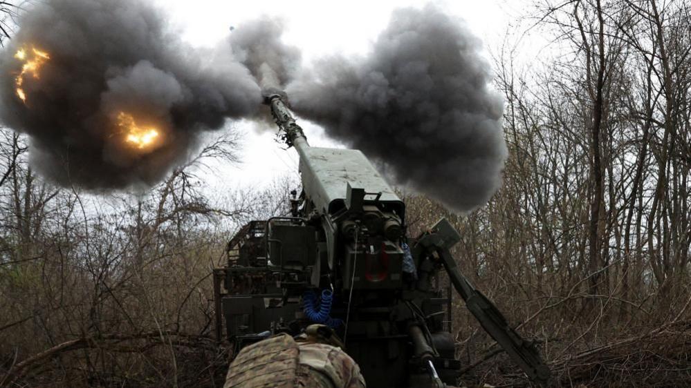 A Ukrainian gunner fires a self-propelled howitzer on Russian positions in Ukraine's eastern Donetsk region. File photo