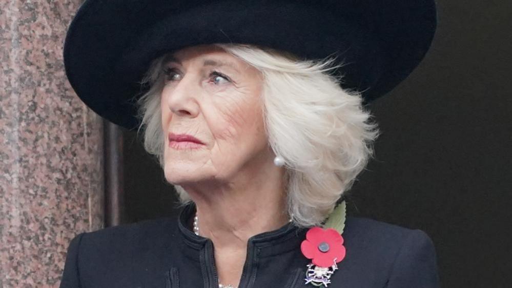 The Queen - pictured on Remembrance Sunday last year - wearing a black hat, black coat and a poppy on her left lapel