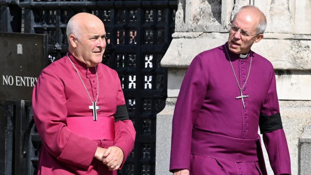 Archbishop of York Stephen Geoffrey Cottrell (L) and The Archbishop of Canterbury Justin Welby walk in central London on September 14, 2022, ahead of the ceremonial procession of the coffin of Queen Elizabeth II, from Buckingham Palace to Westminster Hall.