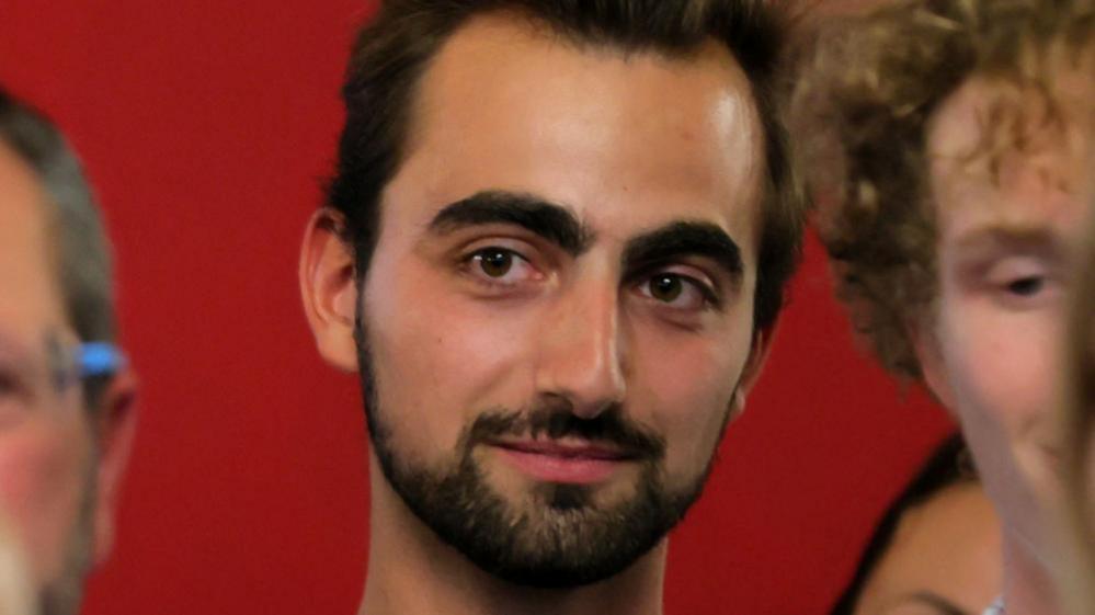 Portrait photo of Henri, a man dubbed France's "hero with a backpack"