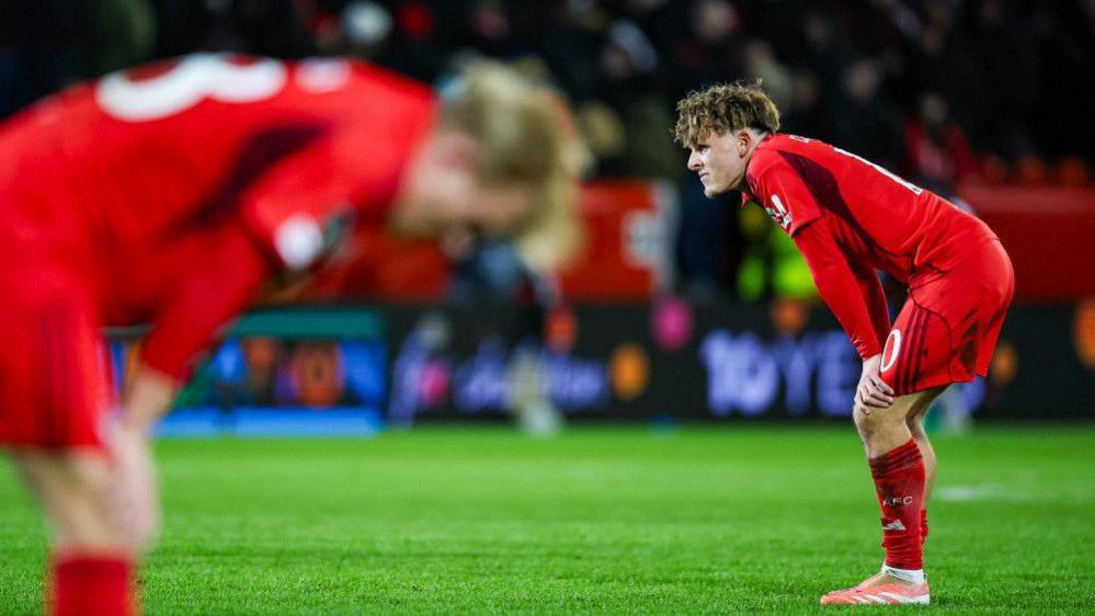 Leighton Clarkson stands with his hands on his knees