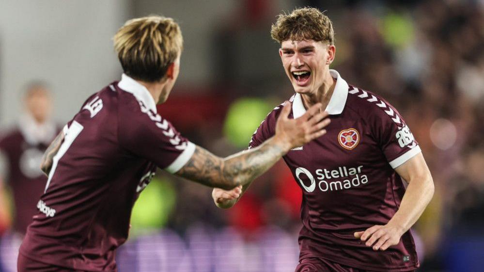 Hearts' James Wilson (R) celebrates with Calvin Miller (L) after scoring to make it 2-1 during a UEFA Conference League Playoff Round First Leg match between Heart of Midlothian and Rapid Vienna, at Tynecastle Park, on August 20, 2026, in Edinburgh, Scotland