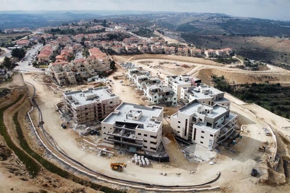 A picture taken with a drone shows a construction site of a new neighborhood in the Neve Daniel settlement, in the Gush Etzion settlement block at the West Bank, 15 February 2023.