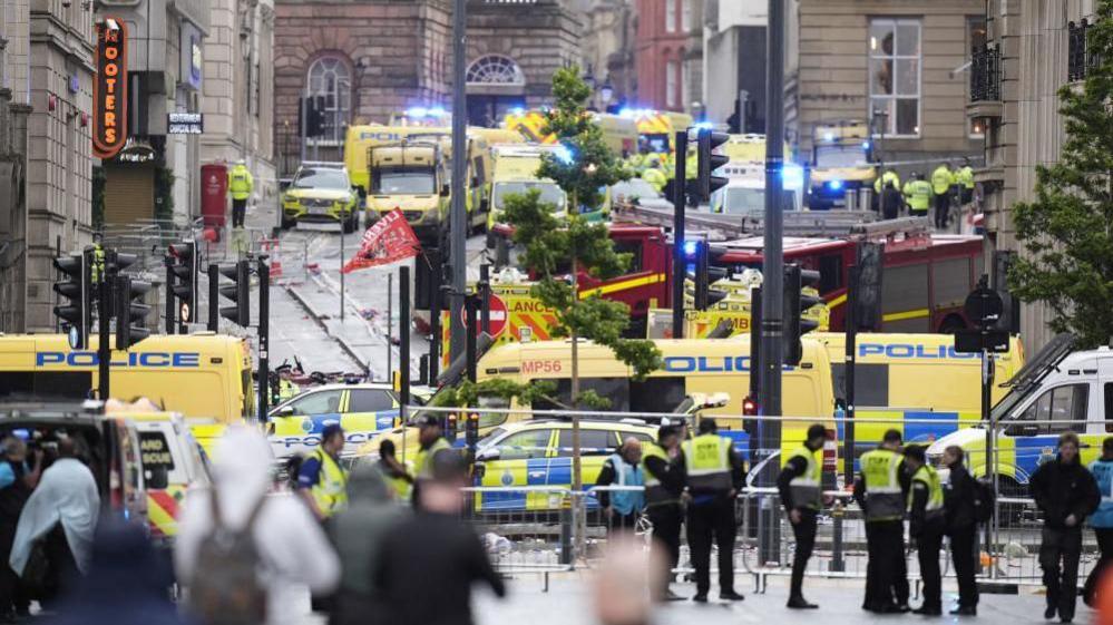 Emergency services on Water Street shortly after a car hit pedestrians
