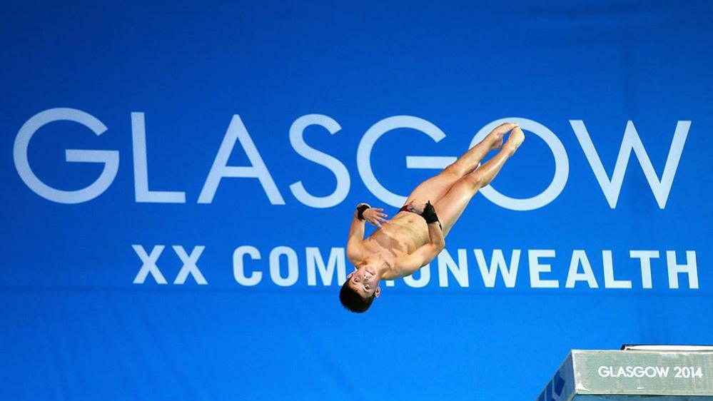 Tom Daley mid dive at the 2014 Commonwealth Games