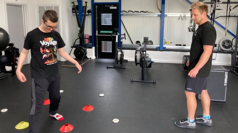 Zac Hollinshead carrying out a gym session with his personal trainer, Harrison Barnes