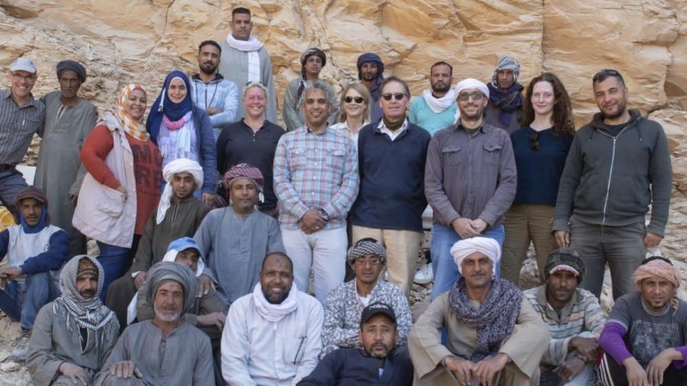 Group shot of the team of archaeologists - who discovered the tomb of Egyptian pharaoh, Thutmose II, in the Western Valleys of the Theban Necropolis in Egypt. There are around 30 people in the photo