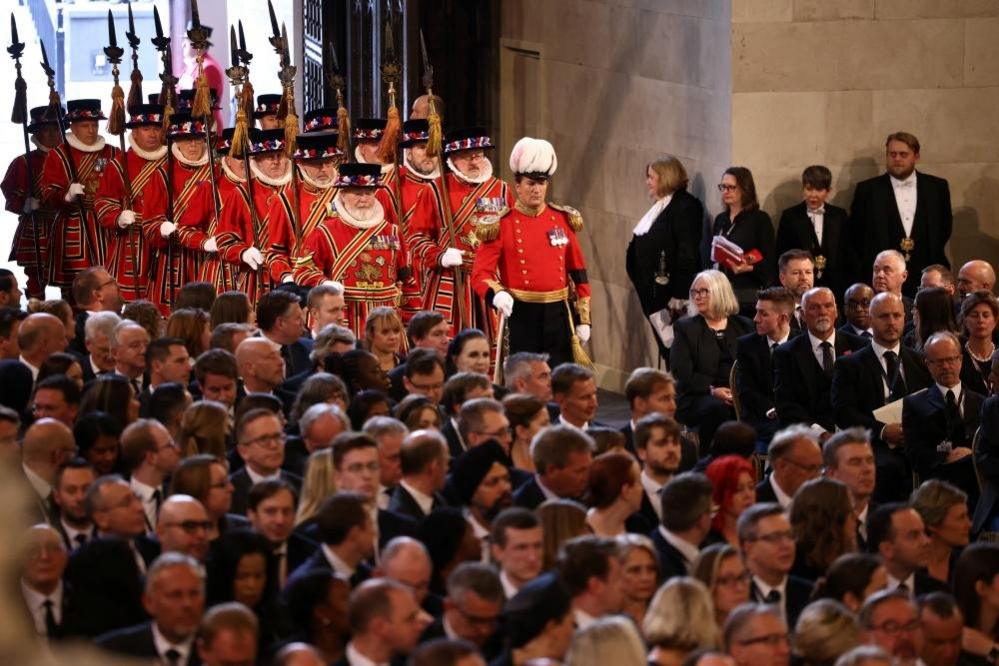 Royal guards walk in Westminster Hall,