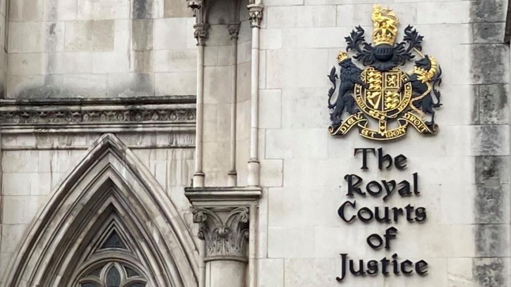 The grand exterior of the Royal Courts of Justice in London