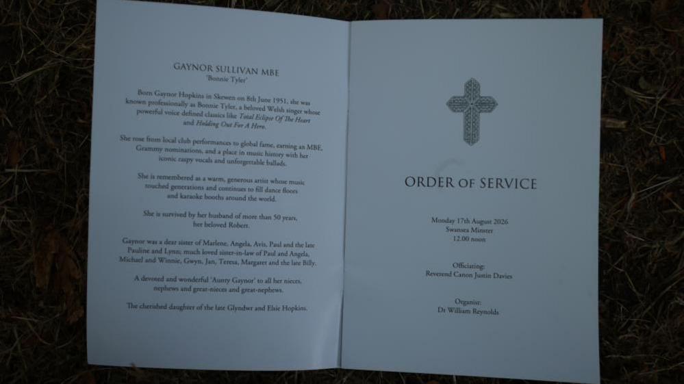 An opened order of service has writing including ' Gaynor Sullivan MBE' with 'Bonnie Tyler' written below. It also says she was a 'beloved Welsh singer whose powerful voice defined classics like Total Eclipse of the Heart'.