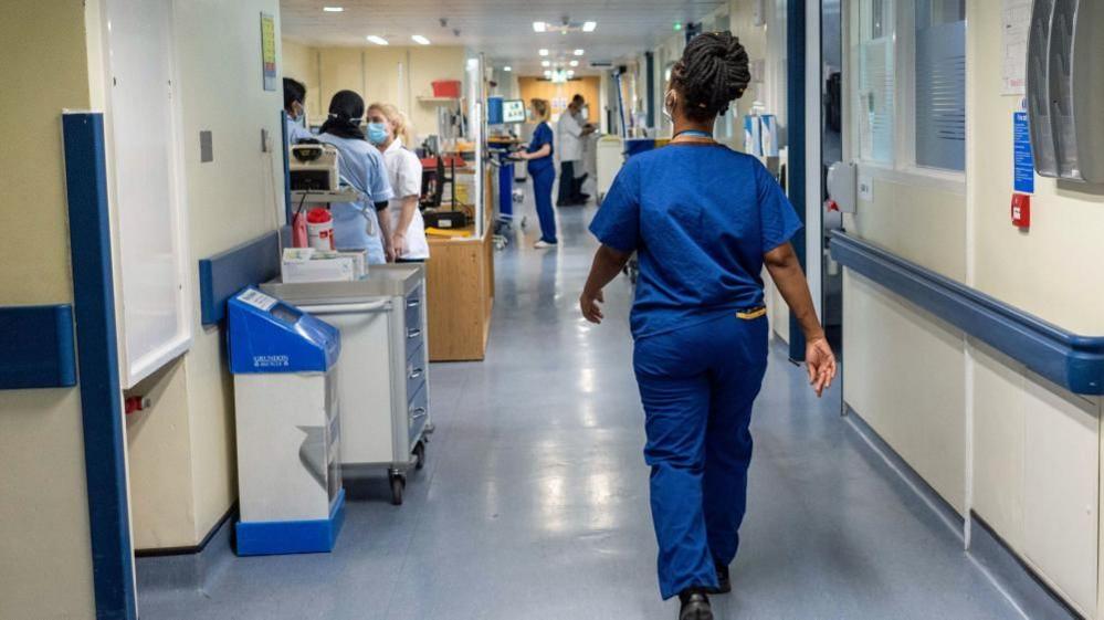 Medical staff walking in a hospital corridor 