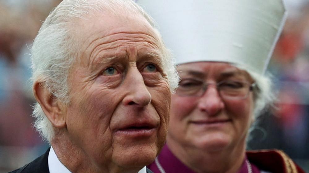 King Charles outside Durham Cathedral with a bishop behind him