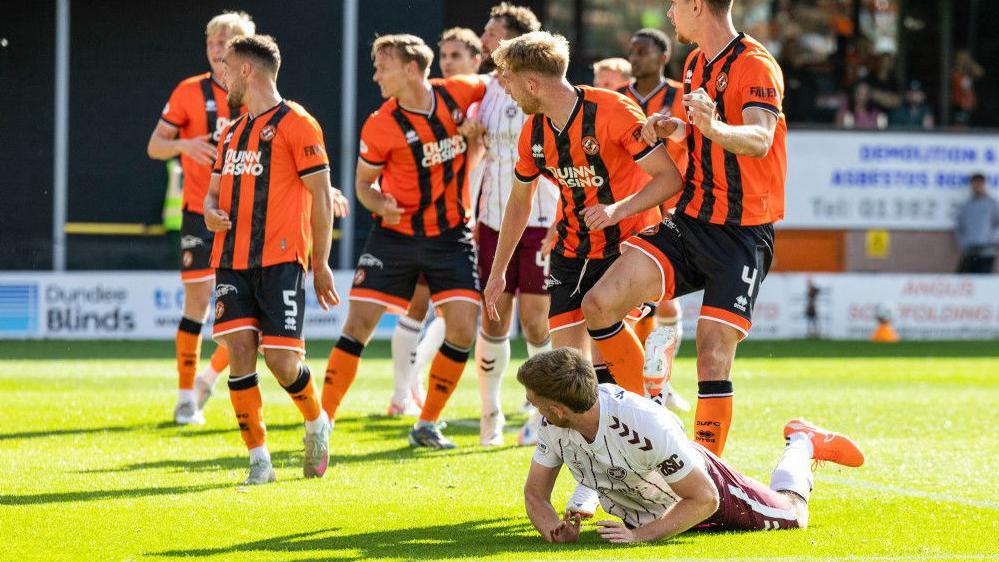 Hearts' Stuart Findlay watches as his header goes in to make it 3-2 during a William Hill Premiership match between Dundee United and Heart of Midlothian at the CalForth Construction Arena at Tannadice Park,