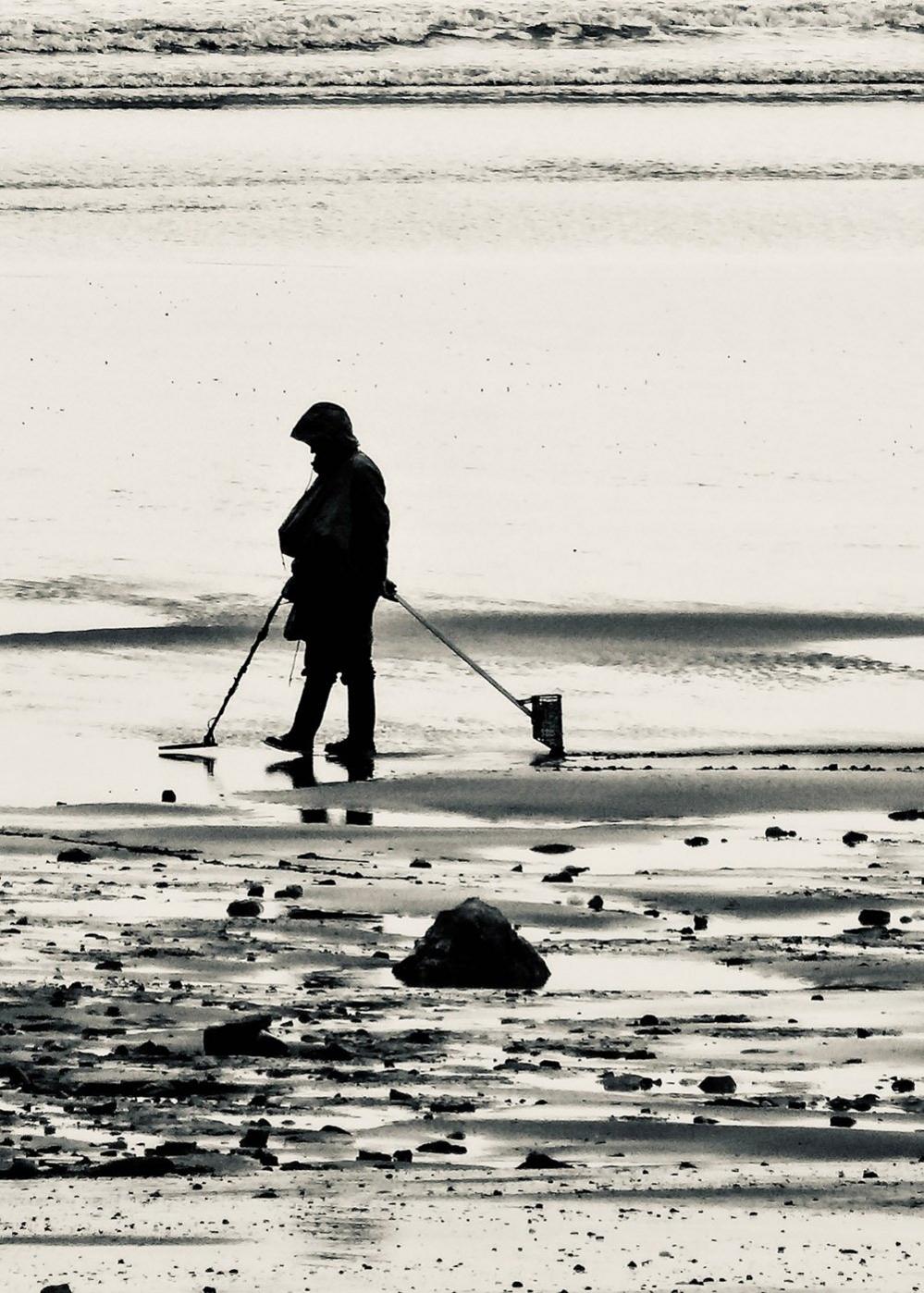 A man using a metal detector