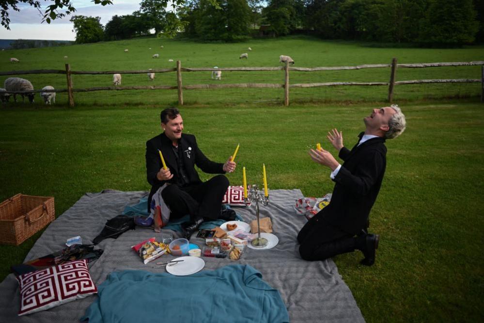 Opera fans attempt to light candles