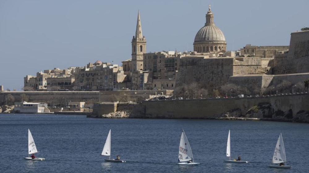 Valletta skyline with yachts in the sea in the foreground