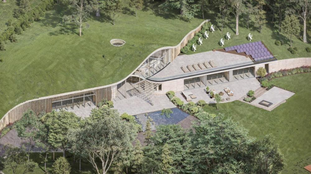 An aerial artist's impression of The Wilderness, showing terraces, and lawns, with solar panels and wind turbines on the roof section.