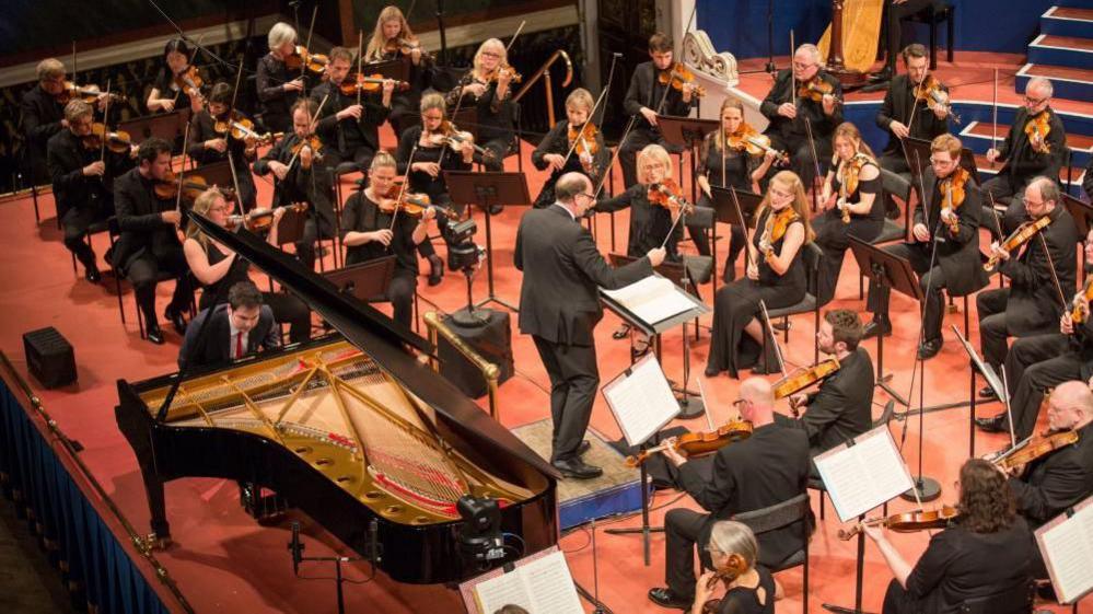 Image of an orchestra playing at the 2021 Leeds International Piano Competition