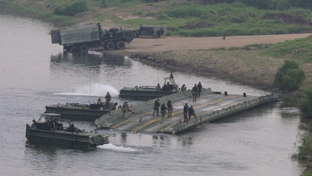 US troops conduct a river-crossing drill on the Imjin River in Paju, South Korea