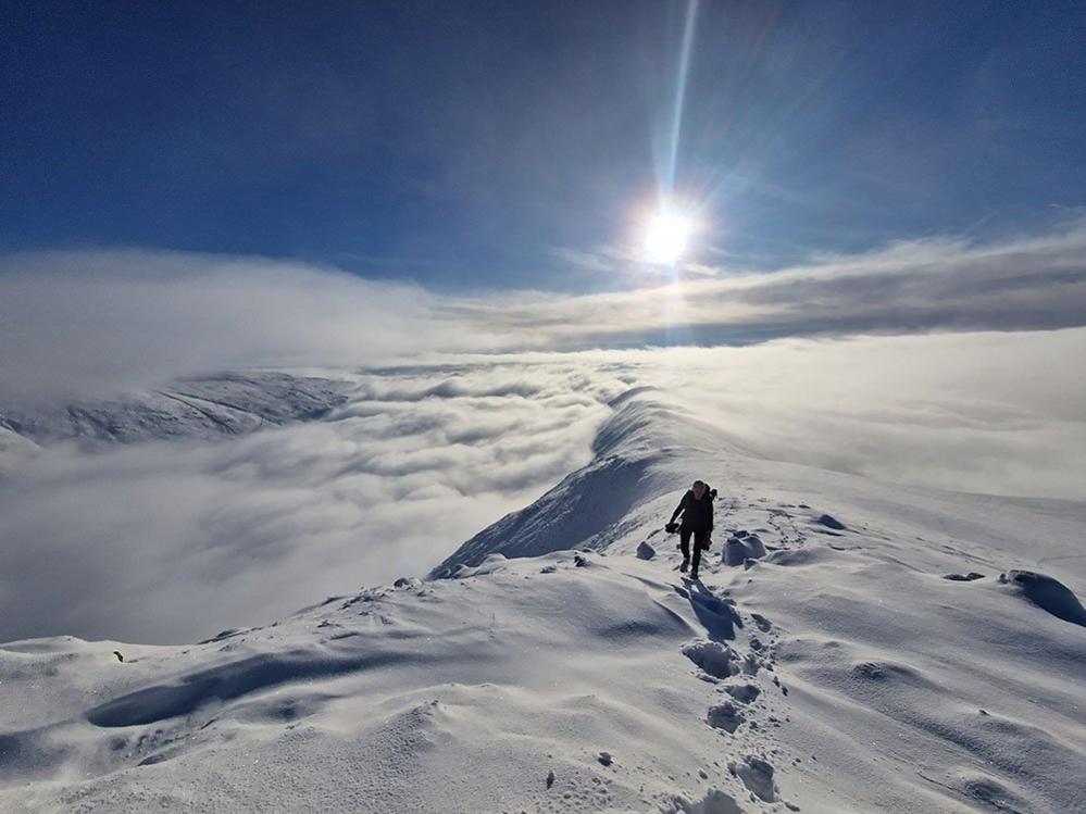 Walker on a snow covered mountain