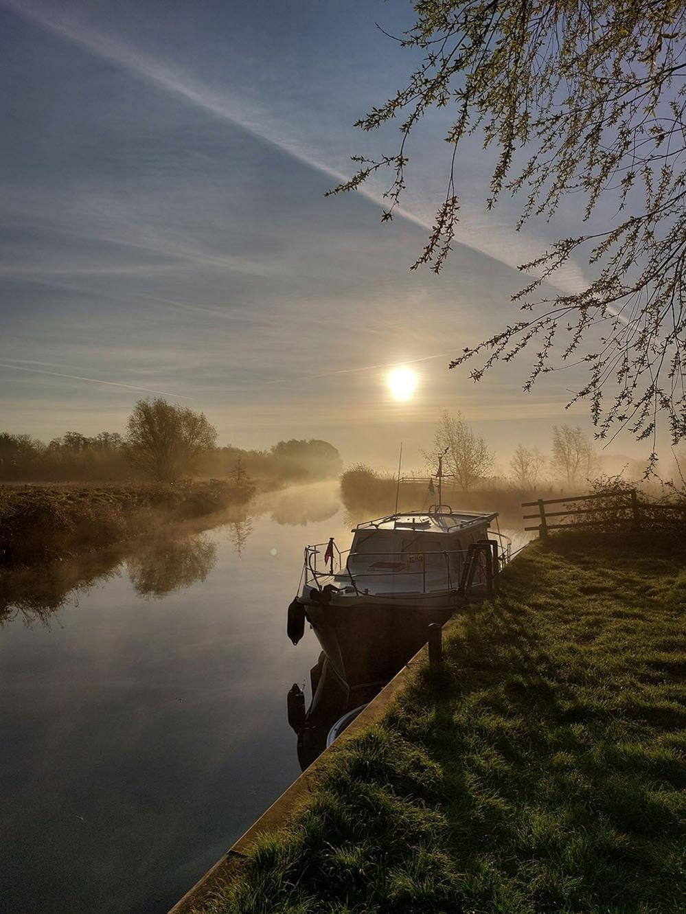 Boat on a misty river