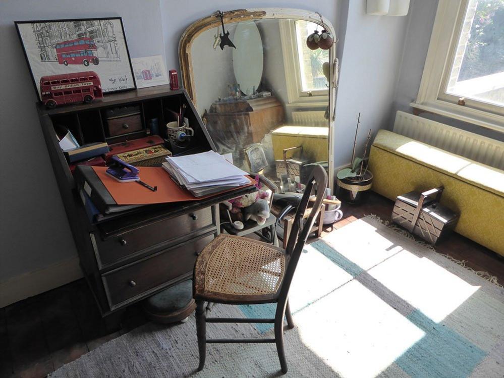 Desk with papers on the top