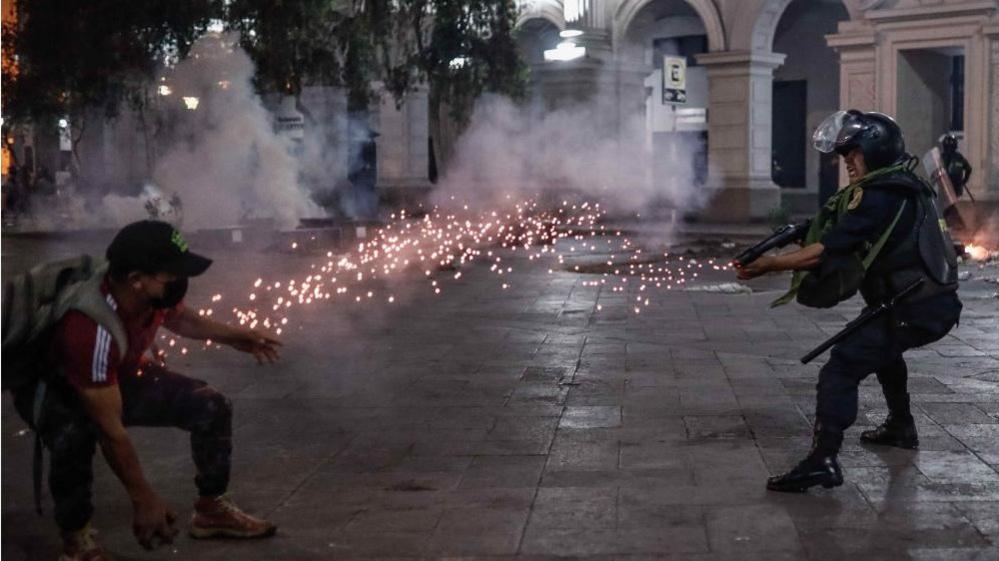 Protesters in favor of Pedro Castillo and against Congress, clash with members of the police in the streets of downtown in Lima, Peru, 11 December 2022.