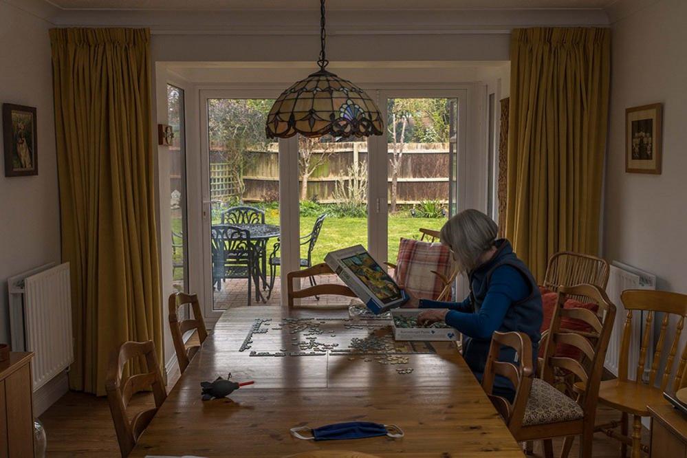 Woman doing a jigsaw puzzle