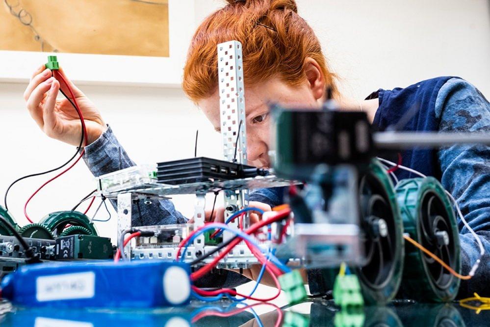 Woman working on a robot