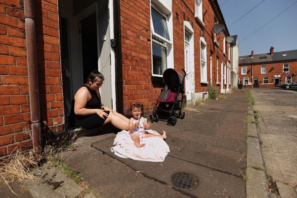 Mother and daughter outside their front door