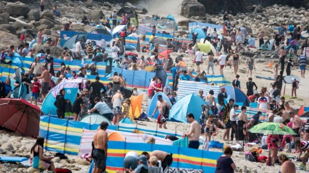 Packed Cornish beach