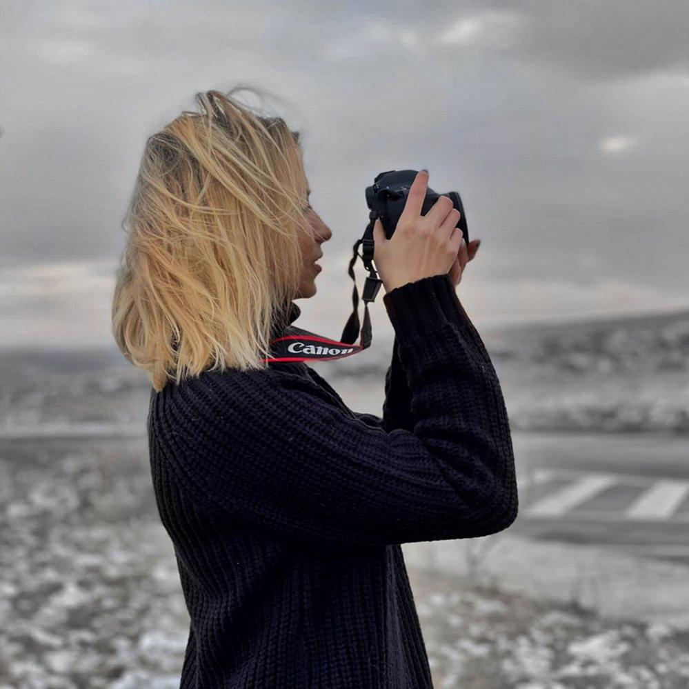 Woman taking a photograph