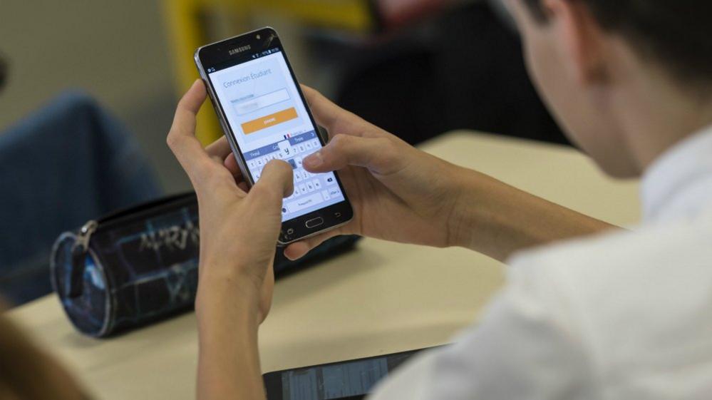 Pupil uses a smart phones at a school in Bischwiller, eastern France. September 26, 2017