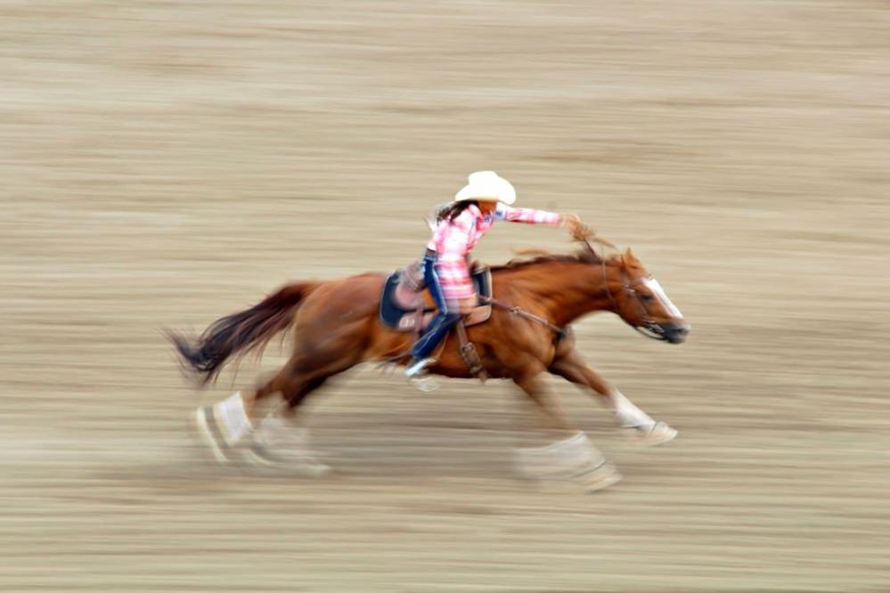 A rodeo competitor on horseback